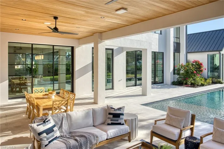 View of patio / terrace featuring an outdoor pool, an outdoor hangout area, and a ceiling fan