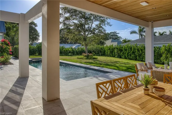 View of pool featuring a fenced in pool, outdoor dining area, a yard, a patio area, and an outdoor living space