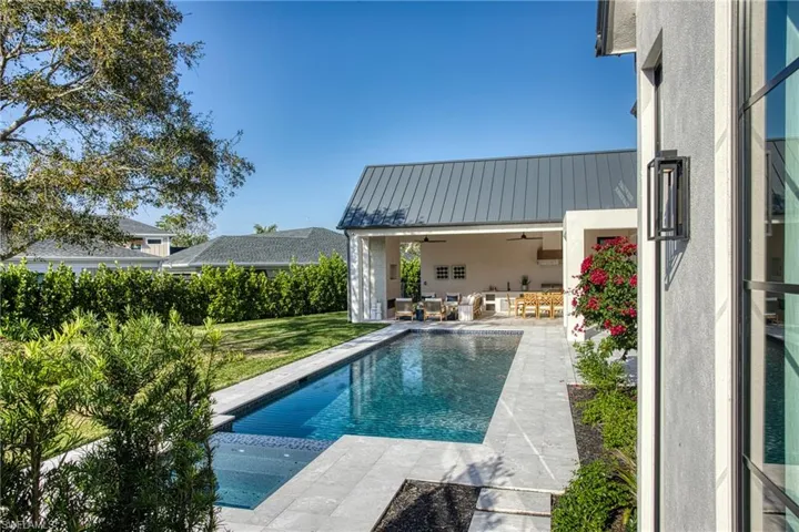 View of pool with an outdoor hangout area, a pool with connected hot tub, a patio area, and a ceiling fan