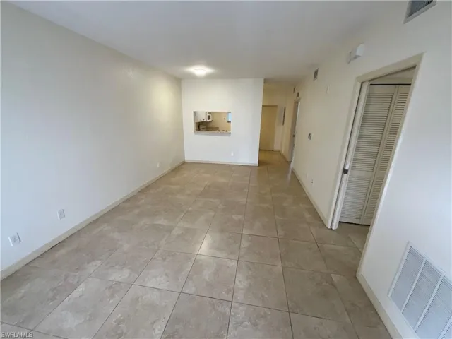 Unfurnished room with light tile patterned floors