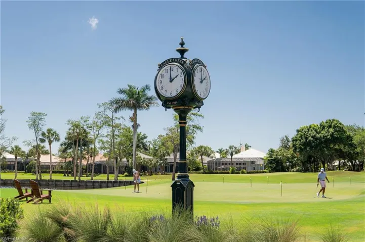 View of home's community featuring a lawn and golf course view