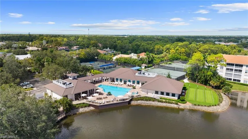 Bird's eye view of a pool area and a large body of water
