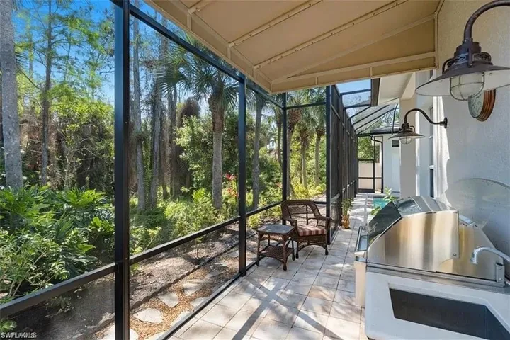 Sunroom / solarium with lofted ceiling