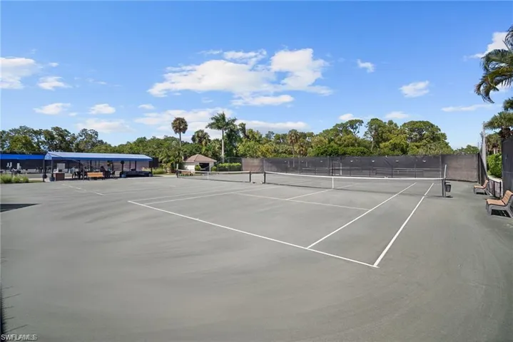 View of tennis court with community basketball court
