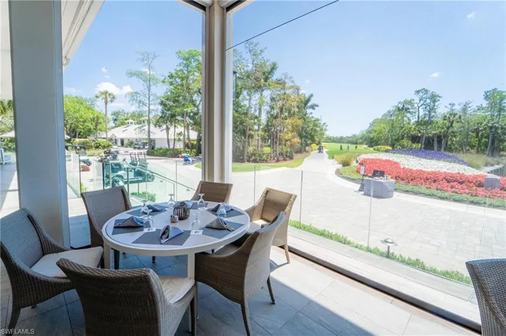 View of patio / terrace featuring outdoor dining area and an outdoor pool