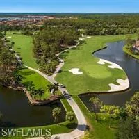Bird's eye view of a nearby body of water and a local golf course