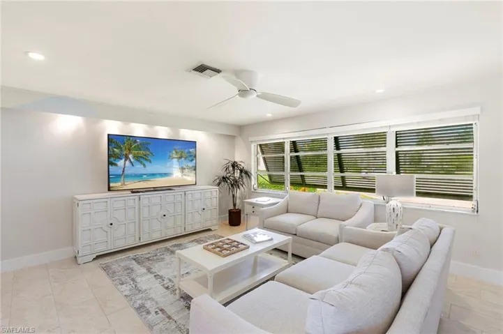 Living room featuring ceiling fan