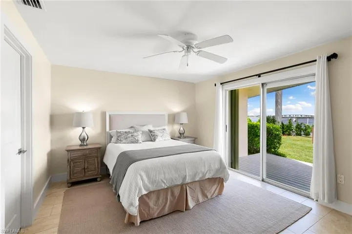Bedroom with access to exterior and ceiling fan