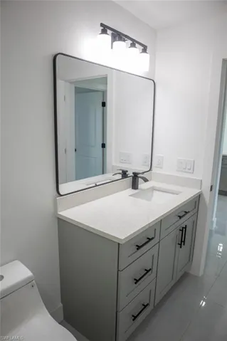 Bathroom featuring vanity and light tile patterned floors