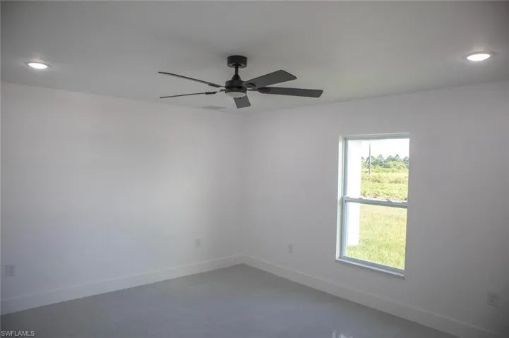 Spare room featuring recessed lighting, a ceiling fan, and tile patterned flooring