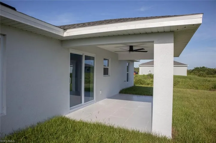 View of patio with ceiling fan