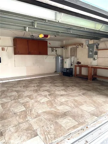 Garage with electric water heater and electric panel