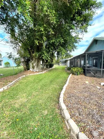View of yard featuring a sunroom