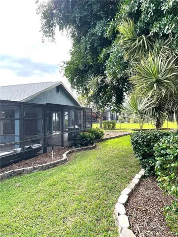 View of yard featuring a sunroom
