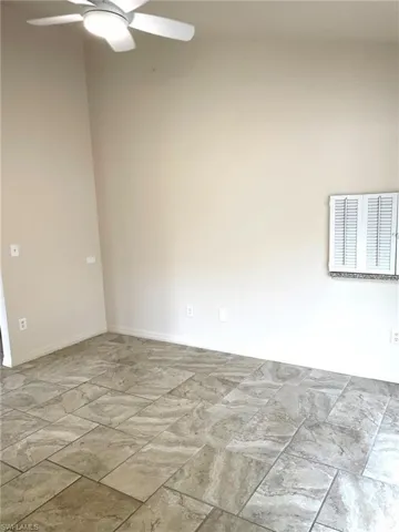 Spare room with ceiling fan