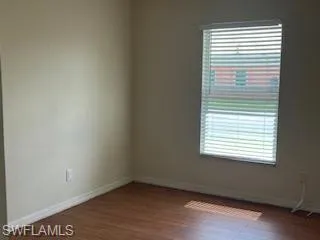 Spare room featuring hardwood / wood-style floors