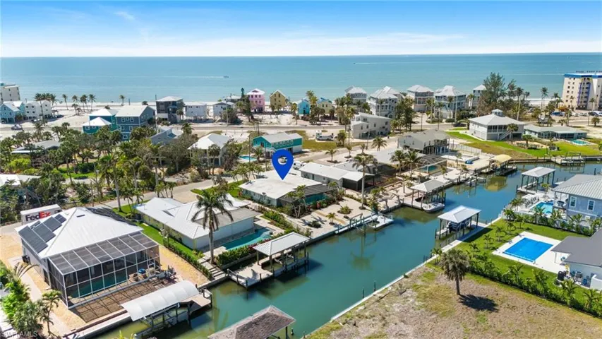 Birds eye view of property featuring a residential view and a water view - VIRTUALLY ENHANCED