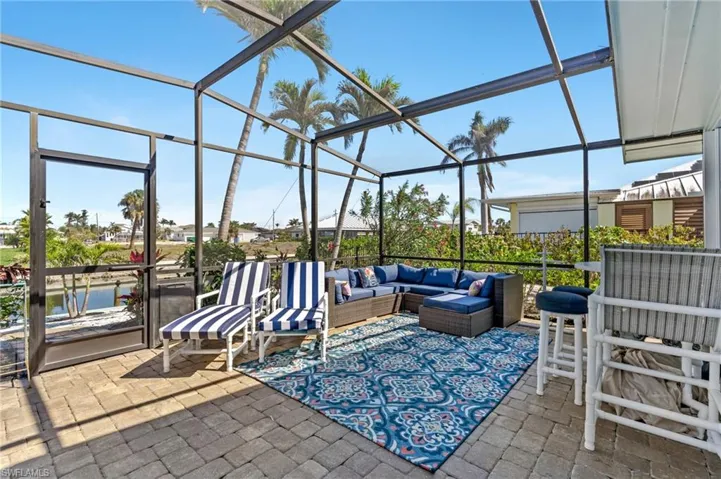 View of patio / terrace with a lanai and an outdoor living space virtually enhanced image