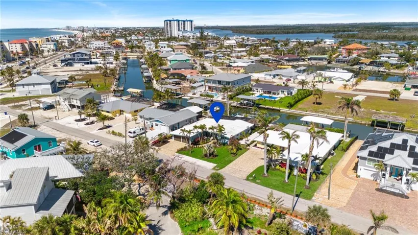 Birds eye view of property featuring a residential view and a water view virtually enhanced image