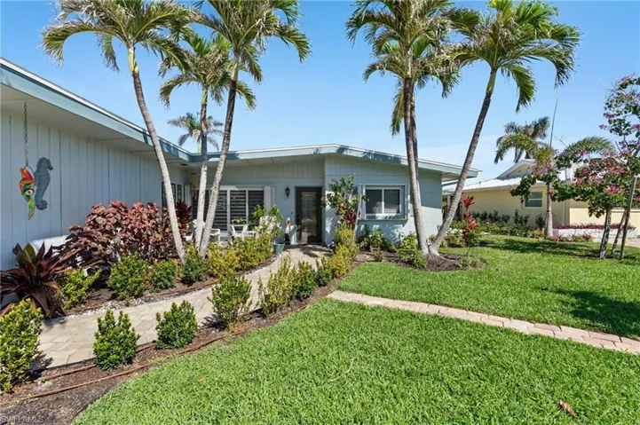View of front of house with a front yard virtually enhanced image