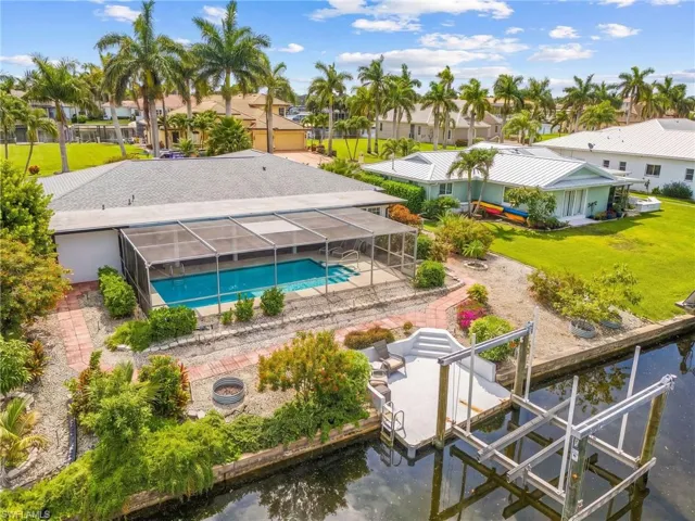 Lush landscaping and boat lift ready for your boat.