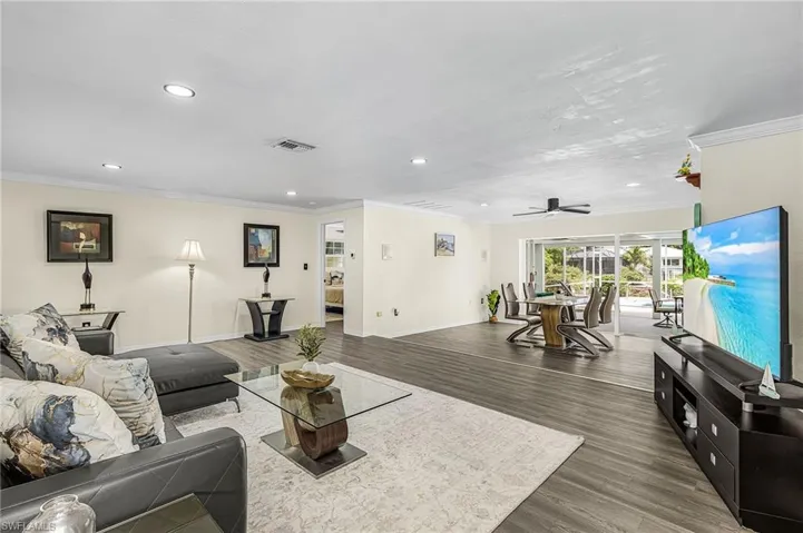 Living room with easy access to dining and main bedroom.