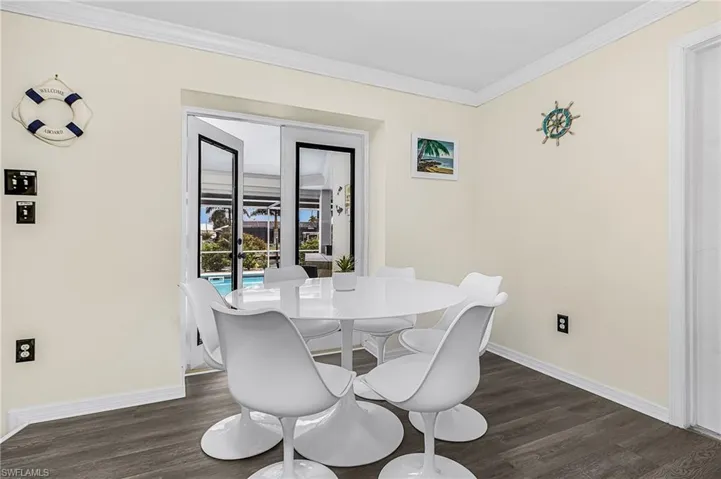 Breakfast nook area that flows to outdoor bar and kitchen.