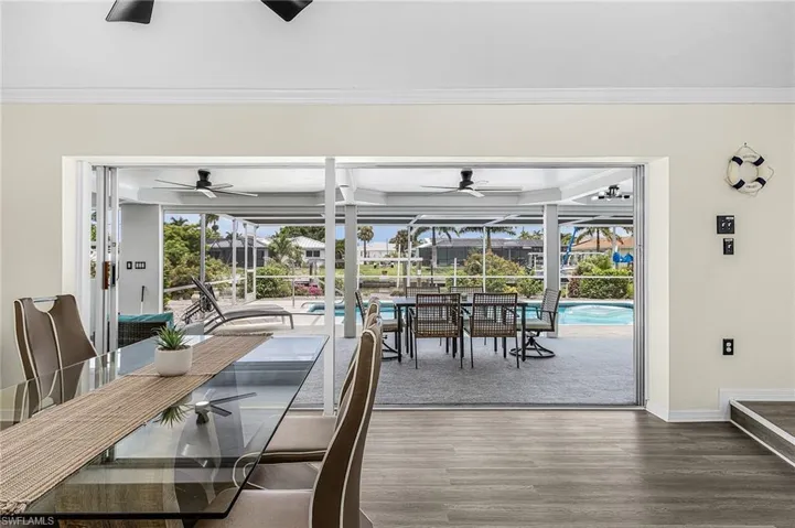 Indoor dining flows well to outdoor dining with stacked slider.