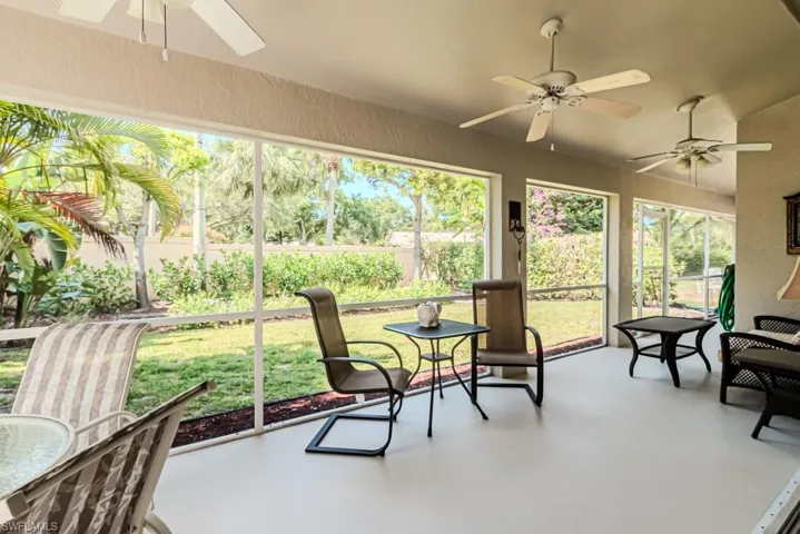 Screened lanai with plenty of natural light and ceiling fan