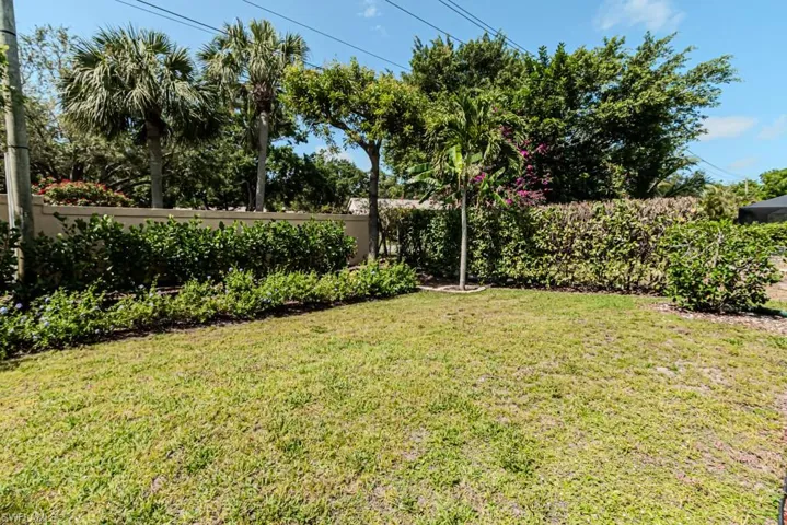 View of yard with beautiful landscaping