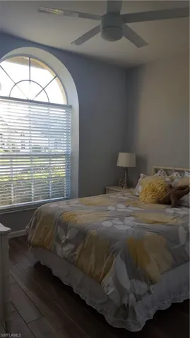 Bedroom with ceiling fan and wood finished floors