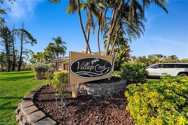 Community sign featuring a yard