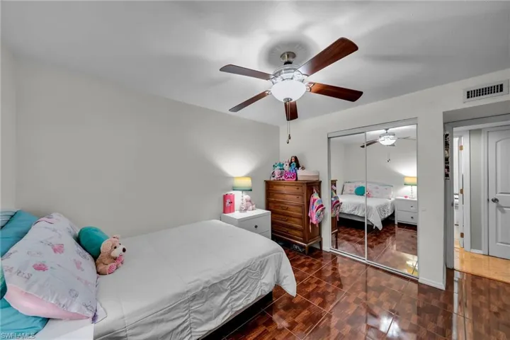 Bedroom with a closet and ceiling fan