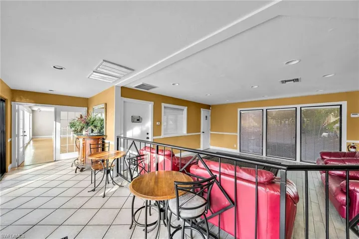 Kitchen with light tile patterned floors and a wealth of natural light
