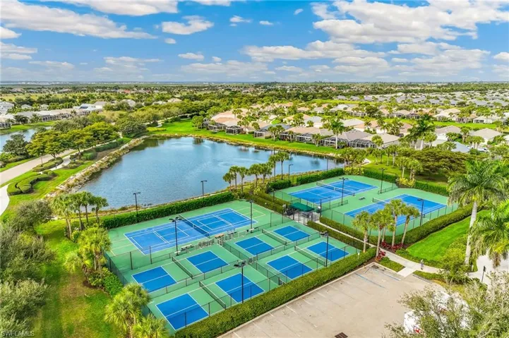 Aerial perspective of suburban area with a nearby body of water