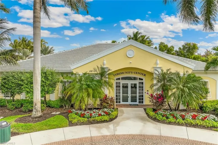 Property entrance featuring french doors, stucco siding, and a tiled roof