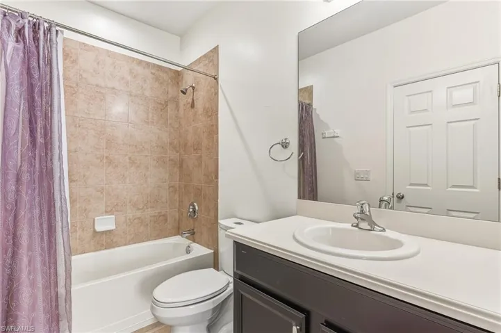 Bathroom featuring vanity and shower / bath combo