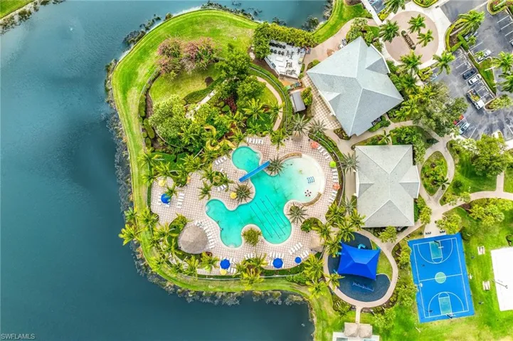 Drone / aerial view of a large body of water and a pool area