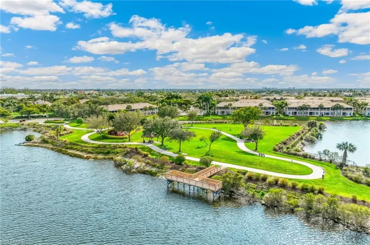 Aerial perspective of suburban area featuring a large body of water