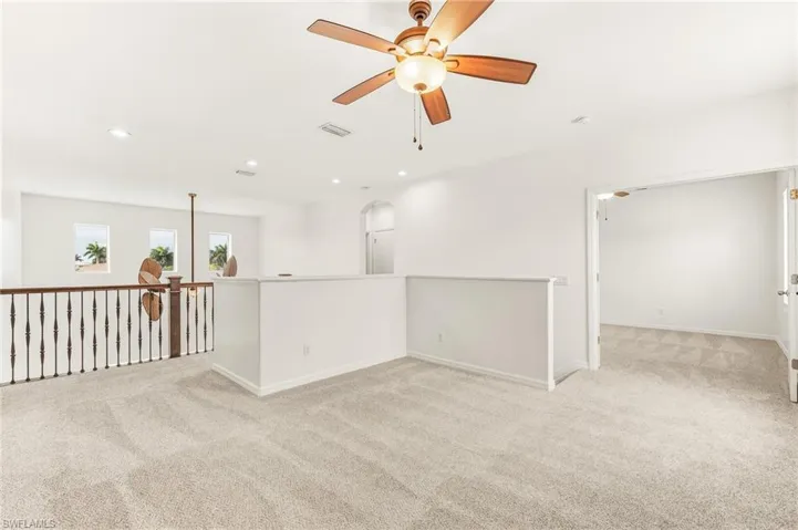 Flex room featuring a ceiling fan, light carpet, and recessed lighting
