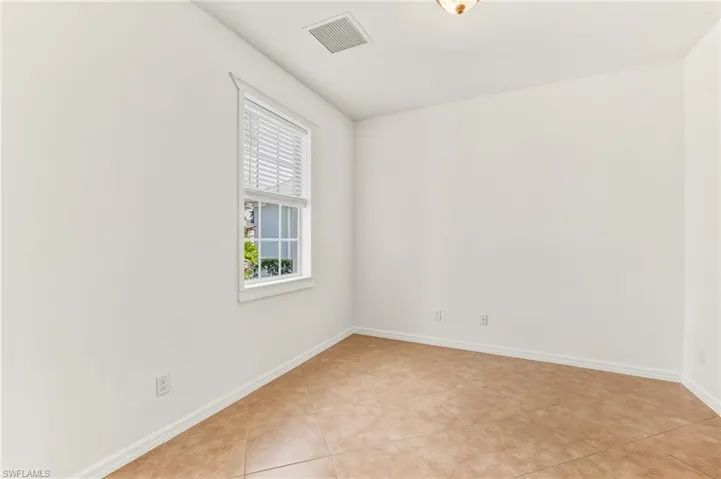Dining room with baseboards and light tile patterned floors