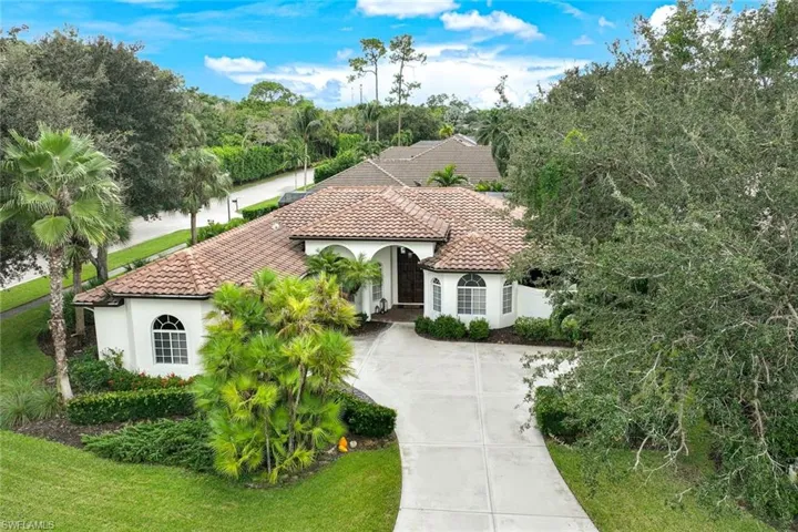 Stunning 3 bedroom+ den, 2 1/2 bath home with tile roof on corner property.