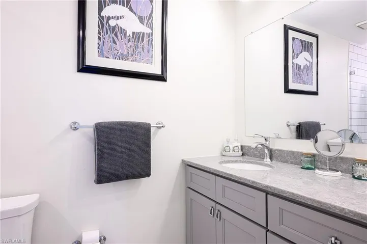 2nd Bathroom with vanity and toilet and walk in shower