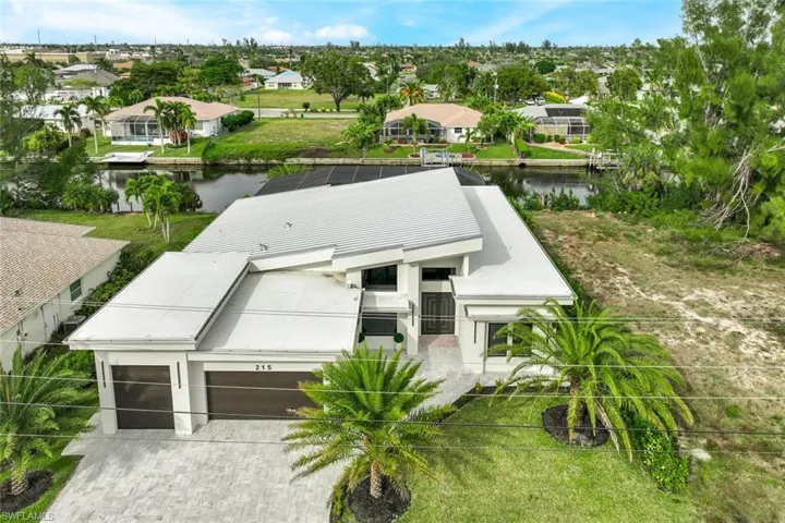 Aerial view of residential area with a nearby body of water