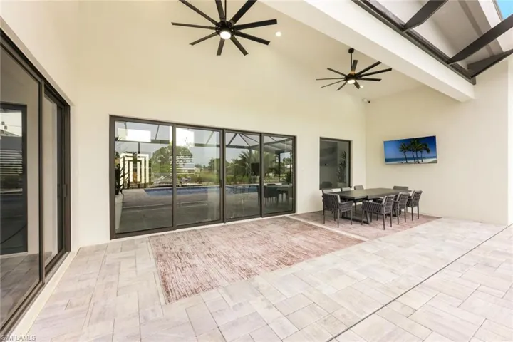 View of patio featuring a ceiling fan and outdoor dining area