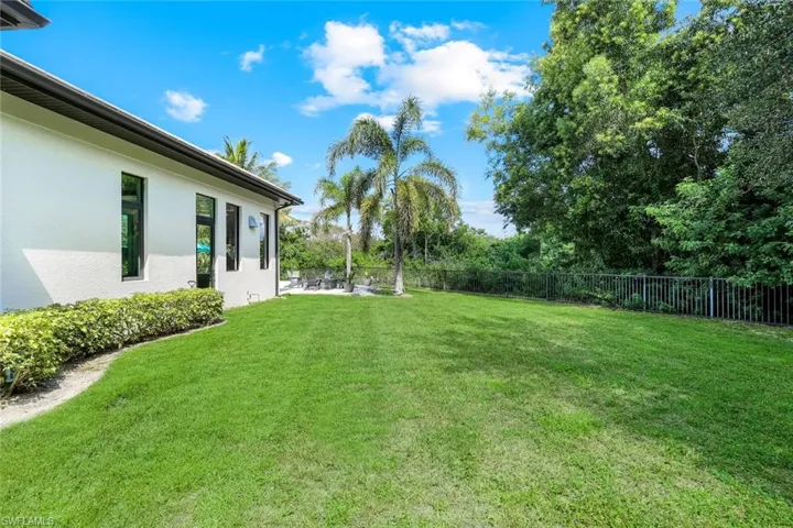 Fenced backyard with a patio area