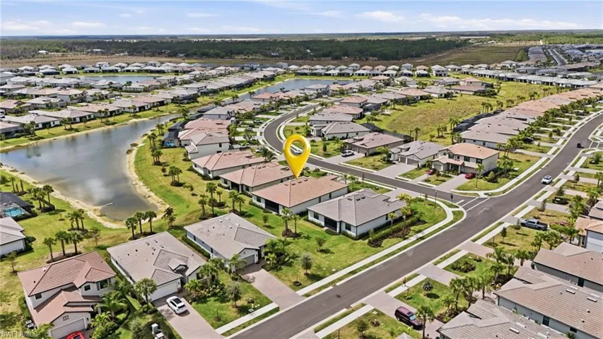 View of property location with nearby suburban area and a nearby body of water