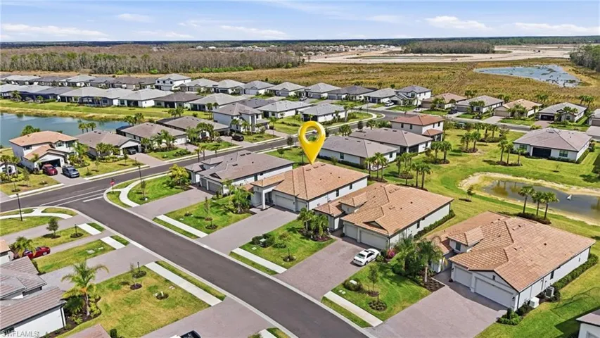 Aerial perspective of suburban area with a large body of water