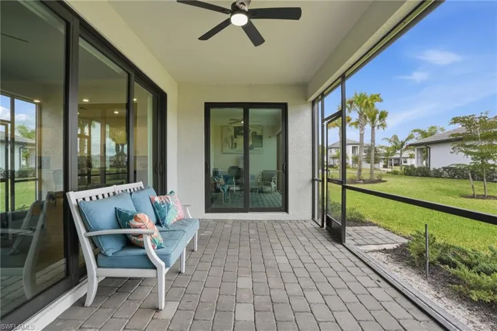 Sunroom / solarium featuring ceiling fan