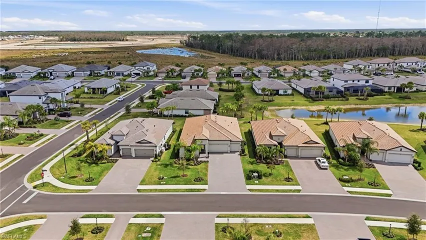 Aerial view of residential area with a nearby body of water